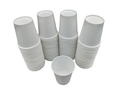 Stacks of white 3 oz paper mixing cups are arranged in rows, with one cup standing upright in front. The cups are small and suitable for mixing or portioning tasks.